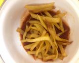 A picture of step 3 of Cheesy fries on the stove.