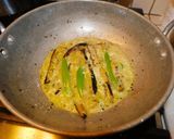 A picture of step 4 of Niramish Doi Begun (Brinjal masala curry).