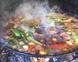 A picture of step 9 of Paella with Vegetables and Meat.