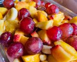 A picture of step 5 of Fruit Salad with Grapes 🍇 banana 🍌, apple 🍎, peach 🍑 & mango 🥭.