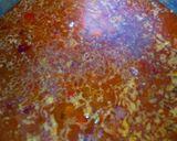A picture of step 6 of Jollof rice with peppered chicken.
