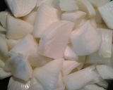 A picture of step 2 of Buttery curried onions with zucchini "noodles".