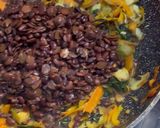 A picture of step 2 of Rice and locust (formented) beans.