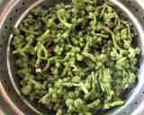 A picture of step 1 of Chingri Pui Metuli (Malabar Spinach Seeds Curry with Prawns).