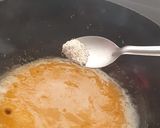 A picture of step 6 of Rava kesari with dessicated coconut and toasted sesame.