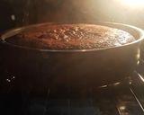 A picture of step 6 of Choco cake with Chocolate ganache topped with Chocolate scrapes.