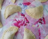 A picture of step 6 of Sardine Empanadas with Tomato and Onion Sauce.