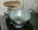 A picture of step 13 of Ashtami special prasaad the puri chana and halwa thali.