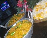 A picture of step 8 of Dam allu with colourful zeera rice.