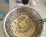 A picture of step 2 of Blueberries and vanilla frosted cup cakes.