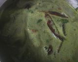 A picture of step 4 of Palak panch dal khichdi tempered with burnt garlic.