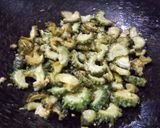 A picture of step 2 of Khate meethe aloo karele.
