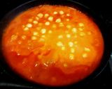 Foto del paso 5 de la receta Garbanzos en salsa de pimiento asado al eneldo con huevo duro