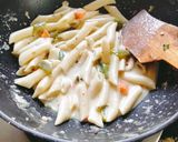 A picture of step 2 of Italian pasta Italian white sauce pasta.