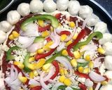A picture of step 7 of Cheese bomb pizza.