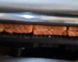A picture of step 6 of Brown bread Potato stuff peanuts butter grilled sandwich.