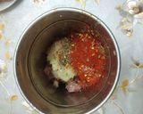 A picture of step 2 of Chicken lollipops.