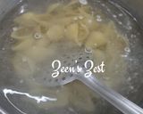 A picture of step 1 of Conchiglioni Pasta with Spinach and Cheese.