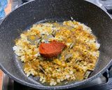 A picture of step 7 of Eggplant Curry with Mushrooms, Tomatoes, and Coconut Milk.