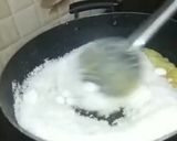 A picture of step 3 of Coconut burfi using milk powder.