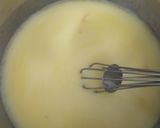 A picture of step 2 of Eggless mawa cup cake topping with shrikhand.