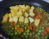 A picture of step 2 of Turnip and Potato Curry with Green Peas.