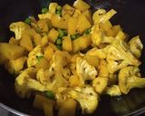 A picture of step 2 of Cauliflower with potatoes and peas.