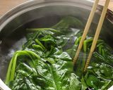 A picture of step 4 of Blanched spinach with sesame dressing.