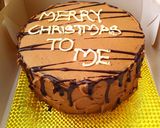 A picture of step 6 of Baileys chocolate cake with baileys buttercream.
