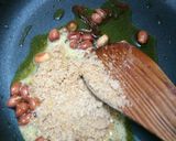 A picture of step 9 of Peanut rice with bundi raita.