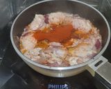 A picture of step 4 of Chicken Pörkölt (Hungarian paprika stew).
