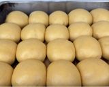 A picture of step 13 of Coconut Sesame Seeds Dinner Rolls.