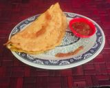 A picture of step 8 of Moong Dal Chilla with Tomato chutney.