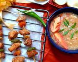 A picture of step 4 of Hot n sour soup with shashlik sticks.