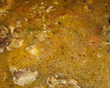 Foto del paso 4 de la receta: Arroz con conejo, sepia, langostinos, calabacín y espinacas