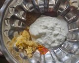 A picture of step 1 of Smokey tandoori chicken drumsticks biryani with mint mango raita.