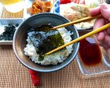 A picture of step 6 of Japanese Breakfast (how to eat Nori seaweed and rice).