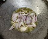 A picture of step 1 of Onion rice with tadka raita.