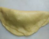 A picture of step 11 of Bow tie buns.