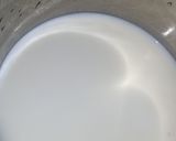 A picture of step 7 of Vanilla cream filled doughnuts.