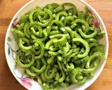 A picture of step 1 of Snake Gourd Poriyal.