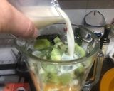 A picture of step 2 of Orange, Kiwi, and Unsweetened Almond Milk Smoothie.
