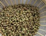A picture of step 1 of Spicy Tangy Moong Khatta Mag Without Onions And Garlic In Cooker.