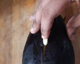 A picture of step 1 of Baingan ka bharta.
