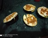 A picture of step 4 of Stuff Brinjal with potato wedges.