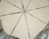A picture of step 5 of Triangle shaped stuffed bread.