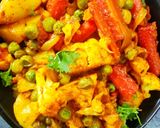 A picture of step 5 of Cauliflower, Potato, Peas, and Carrot Curry.