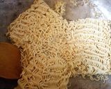 A picture of step 3 of Jollof Vegetable noodles with fried eggs.