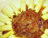 A picture of step 4 of Yam fries with onion sauce.