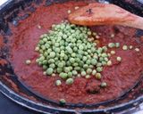 A picture of step 4 of Cashew matar masala.